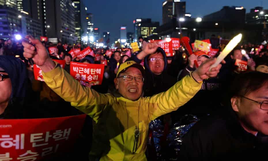 South Koreans celebrate after the constitutional court upheld the impeachment of Park Geun-hye.