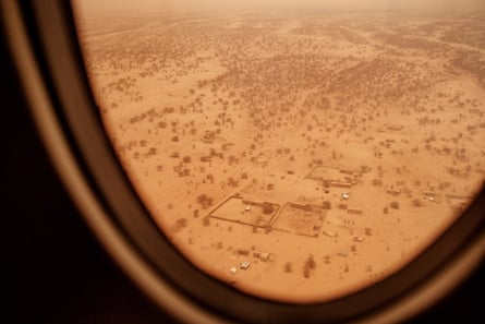 A view from a plane of the vast expanse of Sahara close to Bassikonou and M’bera Camp where bush fires rage after the rainy season under the immense heat of the sun and the gusts of wind that spread the burning.