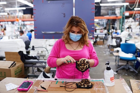 A factory worker makes masks at an LA Apparel factory in April.