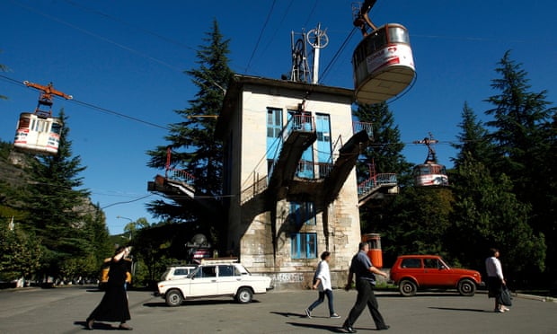 People pass a cable car station that is not running during a power cut in the town of Chiatura, some 220 km (136 miles) northwest of Tbilisi.