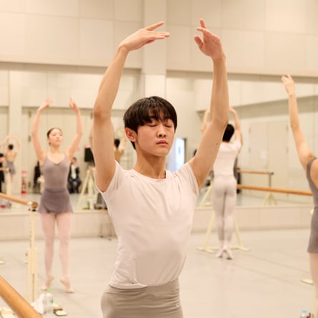 Students from the New National Theatre Ballet School take part in a daily ballet class
