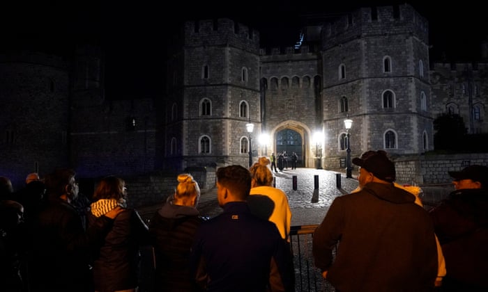 Despite the wet weather, mourners gather outside Windsor Castle, Berkshire, following the announcement of the death of Queen Elizabeth II.