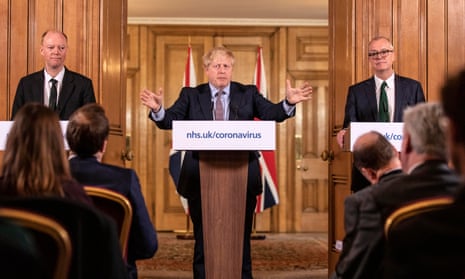 Chief Medical Officer for England Chris Whitty (left) and Chief Scientific Adviser Sir Patrick Vallance stand with prime minister Boris Johnson