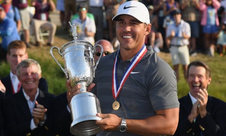 Brooks Koepka celebrates with the US Open trophy during after winning by a shot at Shinnecock Hills.