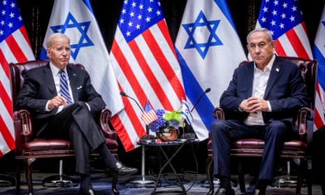 biden and netanyahu sitting in front of israeli and american flags