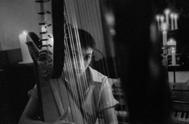 Romany, 64 Candles, Hove, 2024This is another from the 64 candles project. I was using my film camera (for the first time for a decade) so it was a tense few days waiting for them to be developed. This one’s of Romany recording the harp on the album.