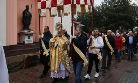 A Catholic priest leads an Easter parade in Zaporizhzhya, Ukraine.