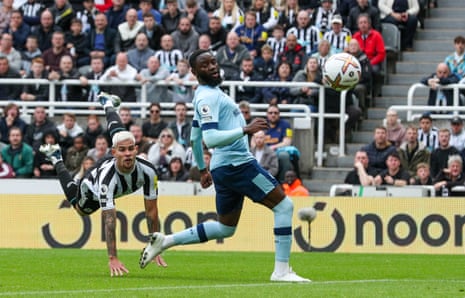 Newcastle United's Bruno Guimaraes heads home the opening goal in their game against Brentford.