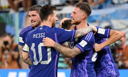 Alexis Mac Allister is embraced by Lionel Messi after scoring for Argentina against Poland