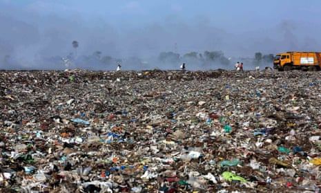 People picking through landfill in Bhopal, India.