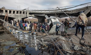 Australia news live update: Morrison says Qld premier ‘consulted’ on emergency declaration; Rio Tinto ditching Russia; 21 Covid deaths 4 Ukrainians cross a destroyed bridge as they flee from the frontline town of Irpin near Kyiv.