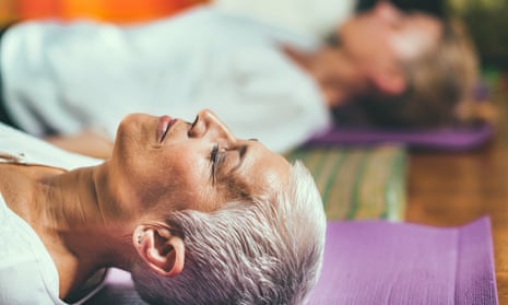Close up of head of a woman lying on a yoga mat