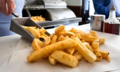 A portion of chips are served at recreation or early 1900s fish and chip shop at the Black Country Living Museum near Dudley