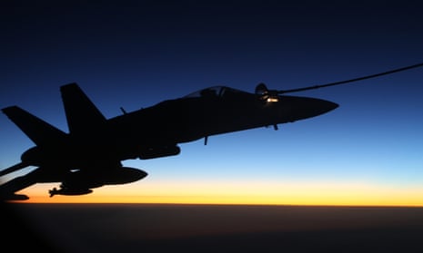 An F/A-18A Hornet from Australia's Air Task Group refuels at sunset from a Royal Australian Air Force KC-30A Multi Role Tanker Transport aircraft during the first mission of Operation OKRA to be flown over Syria