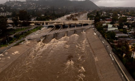 The Los Angeles River roaring through as California gets soaked from storms.