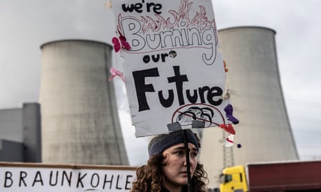 A climate activist protests outside a fossil fuel plant in Jänschwalde, Germany.