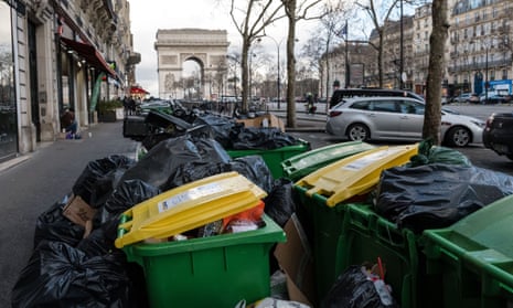 Piled-up rubbish bags left on the street in front of the  Arc de Triomphe in Paris, France, on Tuesday.