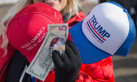 A vendor sells merchandise outside a rally for Republican presidential candidate Donald Trump at the airport in Dubuque, Iowa.