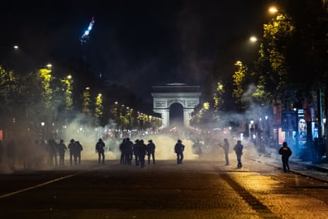 Clashes occur between police and fans on the Champs-Elysées