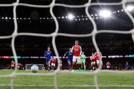 Max Dowman scores his record-breaking goal for Arsenal against Everton, viewed through the net
