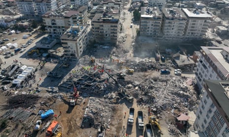 An aerial view of collapsed buildings as search and rescue efforts continue in Gaziantep.