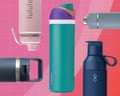 Several reusable water bottles displayed against a pink tiled background, showing various caps and handle designs.