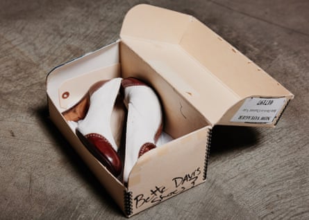 Top: Boxes of props line the walls of the archive. Bottom: Bette Davis’ shoes from Now Voyager.