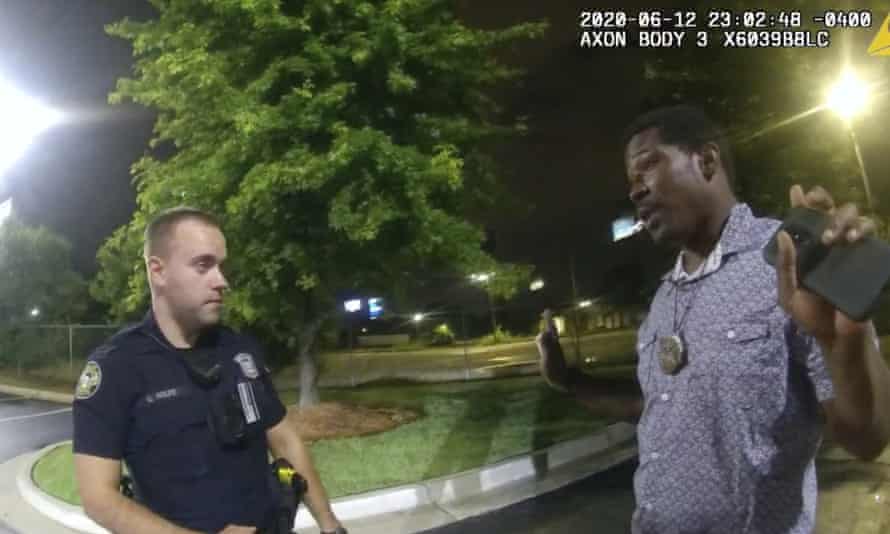 Officer Garrett Rolfe is seen with Rayshard Brooks on a screen grab taken from body-camera video provided by the Atlanta Police Department.