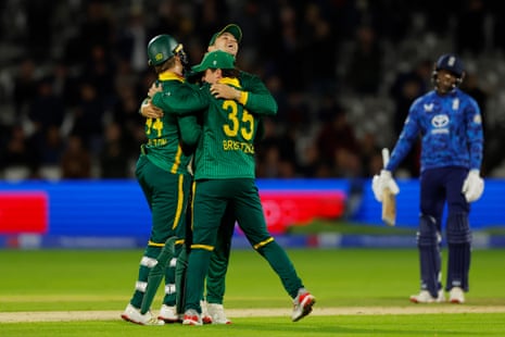 South Africa players celebrate their victory over England.