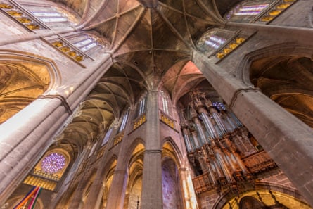 Vaulted ceilings and arches inside a stone-built cathedral