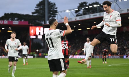 Mohamed Salah celebrates his second goal with Curtis Jones.
