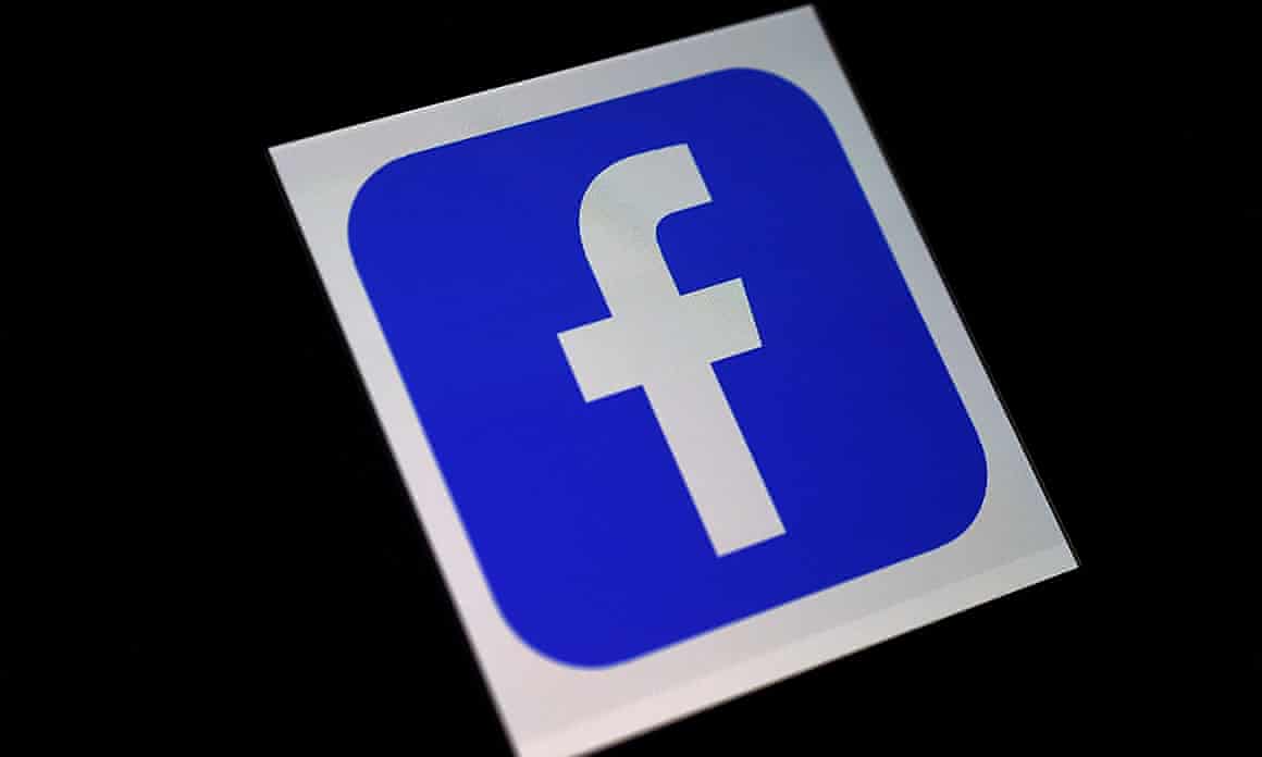 A Facebook logo on a phone