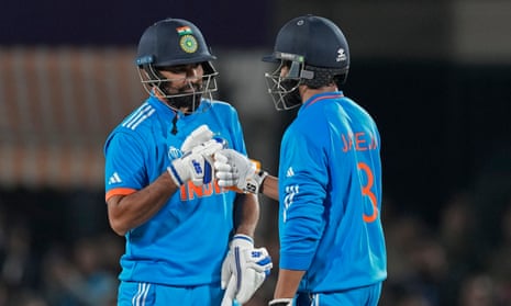 India's Ravindra Jadeja, right, and Mohammed Shami celebrate after their win over New Zealand.