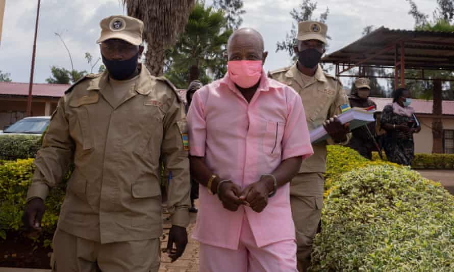 “Hotel Rwanda” hero Paul Rusesabagina, in the pink inmate’s uniform, arriving at Nyarugenge court in Kigali.