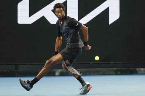 Gael Monfils of France plays a shot between his legs.