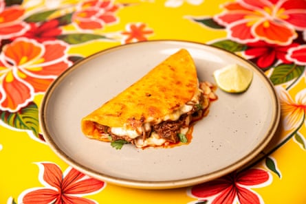 taco on a plate on a floral tablecloth