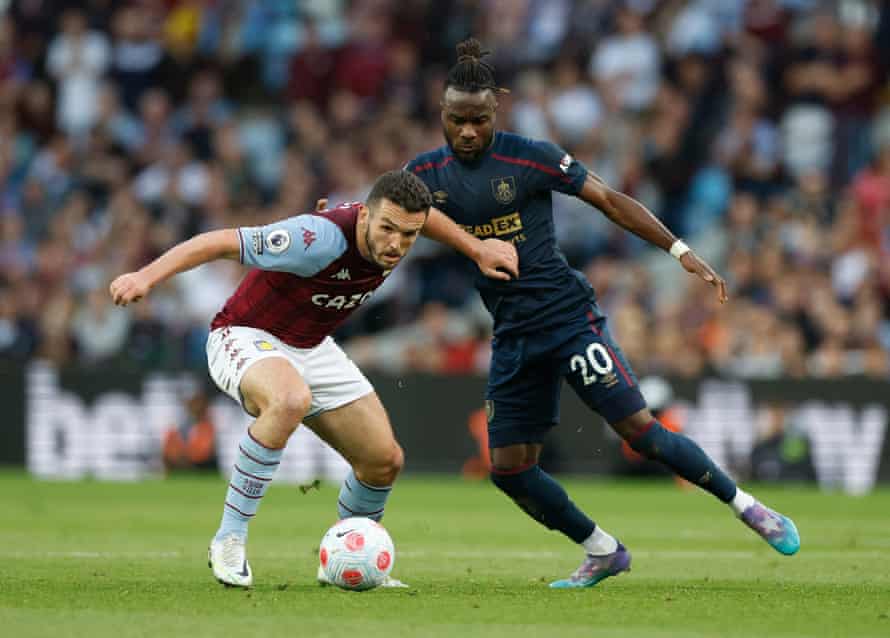 Maxwel Cornet in action with John McGinn.