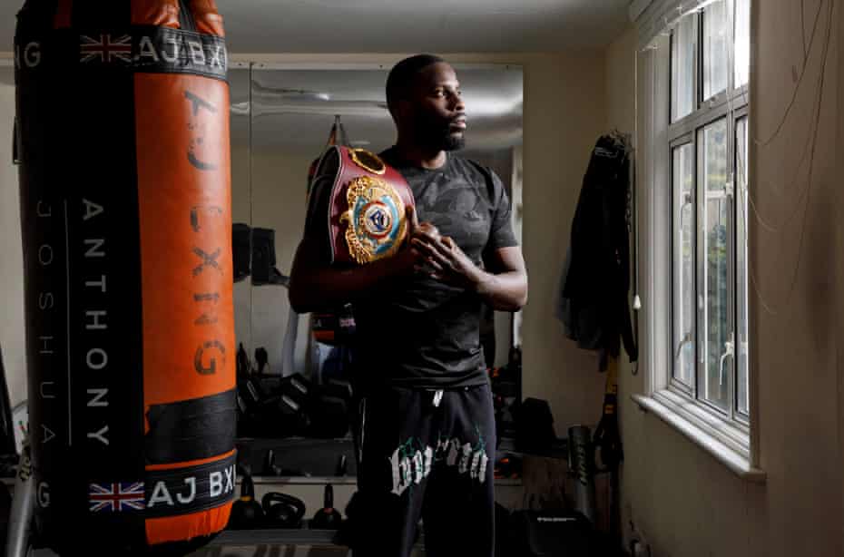 Lawrence Okolie in the tiny gym at the bottom of his garden in Woodford Green, London