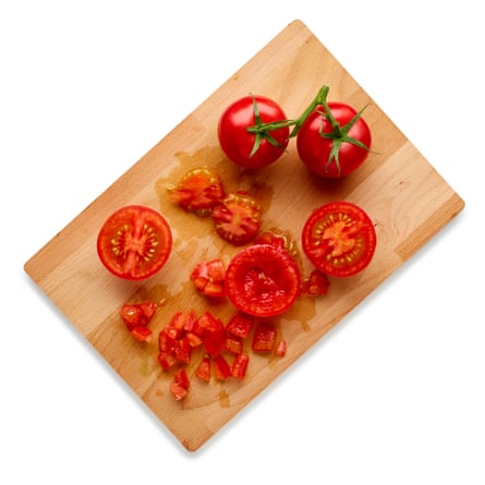 Cut the tomatoes in half, scoop out and discard the watery seeds, then finely chop the flesh.