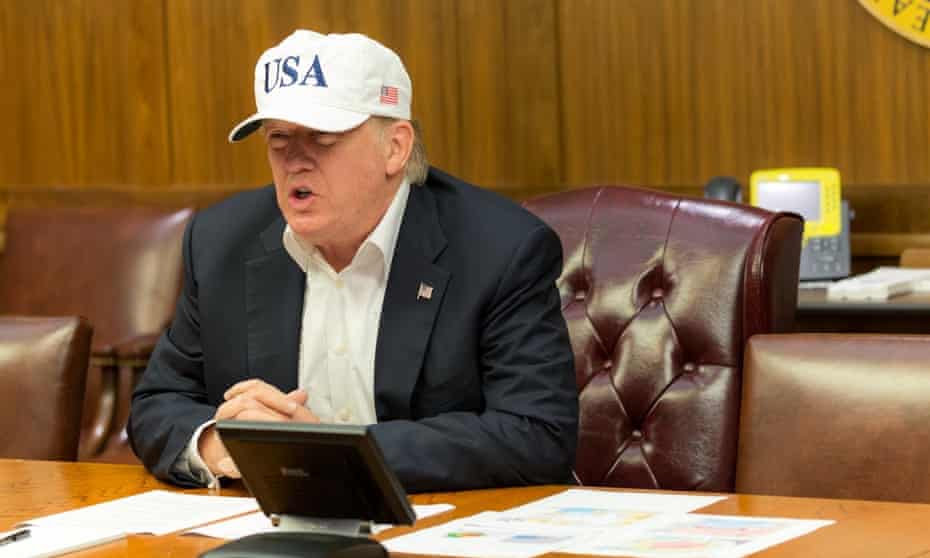 Trump conducting a video teleconference on Hurricane Harvey from a conference room at Camp David.