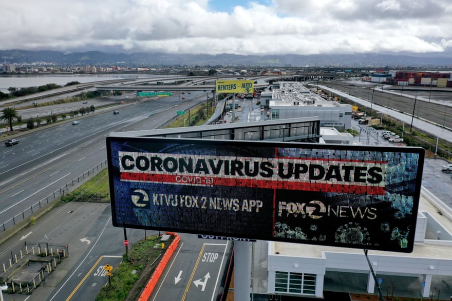 A billboard in Oakland, California, advertises a local news station’s app that provides updates on the coronavirus.