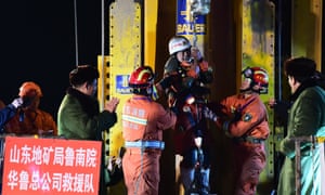 A miner is lifted from the collapsed mine in Pingyi