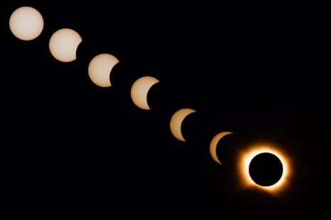 A composite image of seven separate photographs taken with a single fixed camera shows stages of a solar eclipse before, during and after totality, as seen from Arija, Spain
