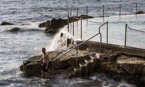 A swimmer enters the sea