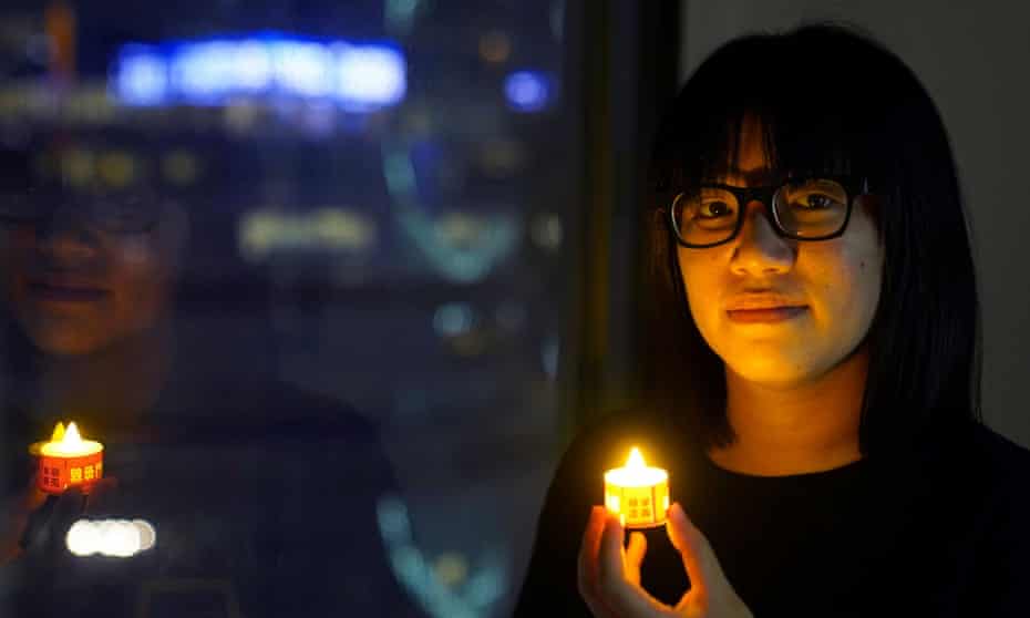 Vice-chairwoman of Hong Kong Alliance in Support of Patriotic Democratic Movements of China, Chow Hang-tung poses with a candle ahead of the 32nd anniversary of Tiananmen Square