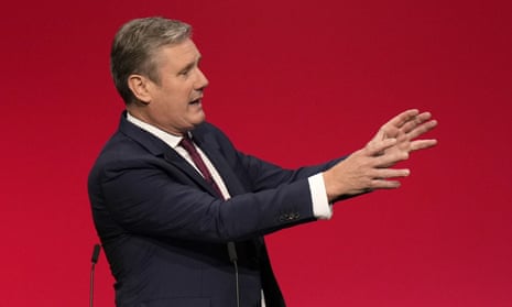 Keir Starmer gestures as he makes his keynote speech at the Labour party conference in Brighton.