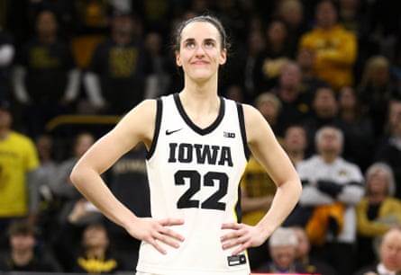 Caitlin Clark listens as the crowd cheers after breaking the NCAA women’s all-time scoring record on Thursday night.