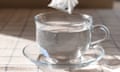 Tea bag being dipped into a cup