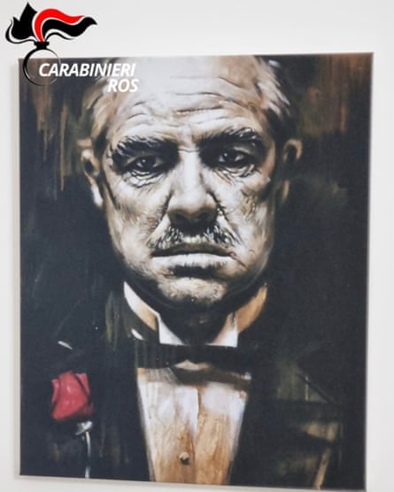 A poster of Marlon Brando in The Godfather, found in Denaro’s apartment