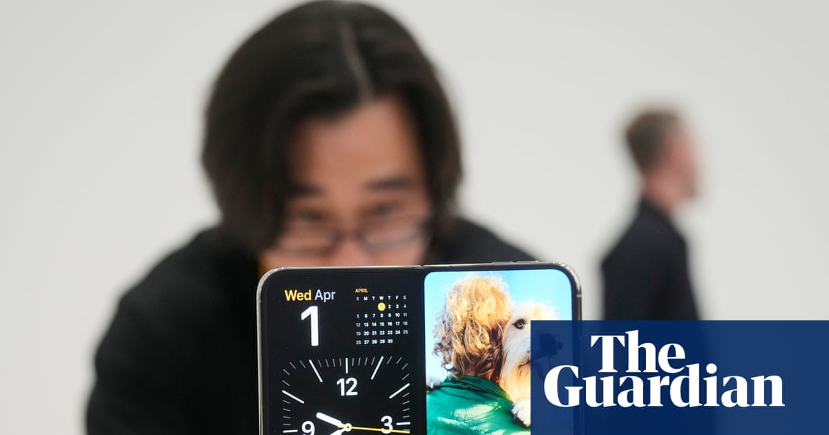 Photo: theguardian.com Apple Unveils First Foldable iPhone Duo and iPhone 18 Pro